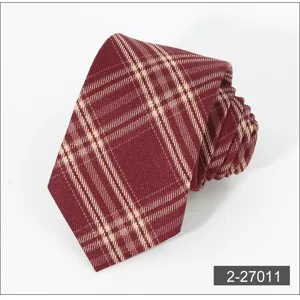 Burgundy plaid business casual tie detail, featuring classic checkered pattern and fine polyester.