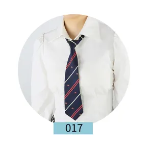 Detailed view of the dark blue jk uniform tie with red and white oblique stripes and crown patterns.