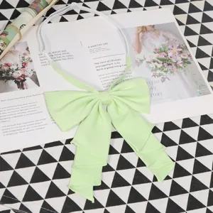Light green fabric bow tie detail, elegant JK uniform collar accessory for daily wear.