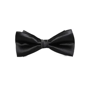 Classic black silk bow tie detail shot, perfect for formal business suits and wedding groomsmen.