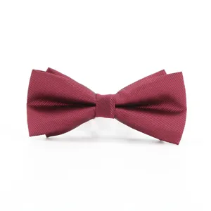 Burgundy men's bow tie detail showing fine twill texture and classic double layer formal design.