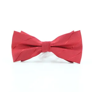 Detailed close-up of a vibrant red men's bow tie featuring fine textured fabric for formal wear.