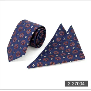 Business tie and pocket square set in deep blue with elegant orange floral geometric patterns.