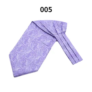 Close-up detail of purple silk-feel mens paisley ascot cravat, elegant wedding business wear.