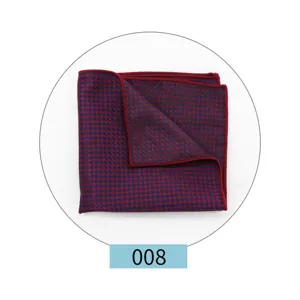 Detailed close-up shot of a red and blue houndstooth patterned suit pocket square.