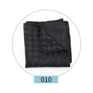Detailed view of the black woven pocket square, showcasing fine craftsmanship and classic texture.