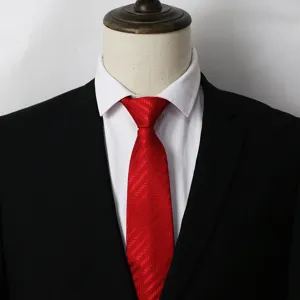 Detailed shot of a classic red striped men's business tie paired with a crisp white shirt.