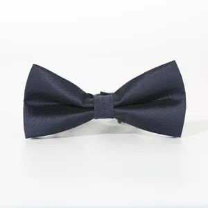 Classic navy blue textured bow tie detail, elegant accessory for formal wedding suits.