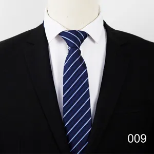 Detailed view of classic blue striped business necktie paired with white shirt and black suit.
