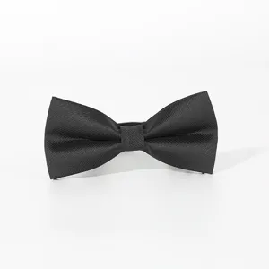 Close-up detail of classic black bow tie for men, elegant twill texture for formal wear.