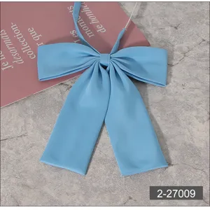 Light blue JK uniform bow tie detail shot, showing smooth fabric and neat flat design.