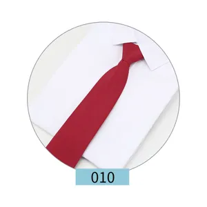 Solid color red necktie for men business formal wear paired with white shirt detail view.