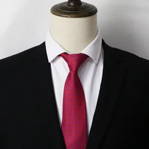 Detailed close-up of a red and blue geometric pattern men's business tie with suit.