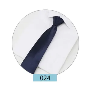 Close-up detail of a classic navy blue men's formal business suit tie paired with a white shirt.