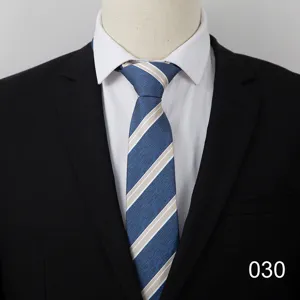 Detail view of men's classic blue and beige striped business tie paired with suit.