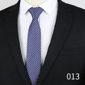Detail shot of blue mens jacquard tie featuring small floral geometric pattern and 6cm width.