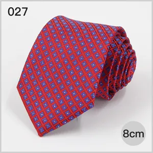 Blue and red geometric patterned mens business suit necktie, detailed view of rolled tie.