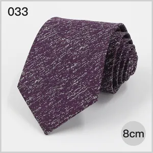 Close-up detail of a purple speckled men's business tie, showing fine texture and 8cm width.