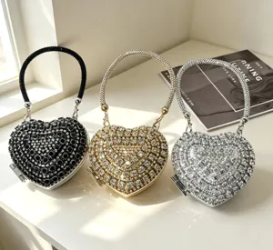 Atemberaubende herzförmige Strass-Abendtasche mit Metallgriff, glänzende Kristall-Mini-Clutch.
