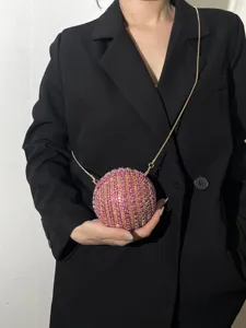 Spherical rhinestone evening bag with gold chain strap, luxury sparkling ball clutch purse for women.