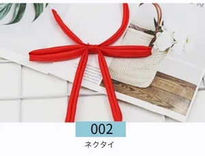 Red JK uniform necktie detail, Japanese style sailor suit ribbon accessory for women.