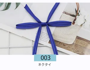 Detail shot of a solid blue JK uniform neck tie ribbon, featuring smooth satin fabric.