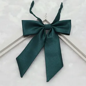 Dark green fine-ribbed JK uniform bowtie close-up detail shot, showing exquisite pointed design.