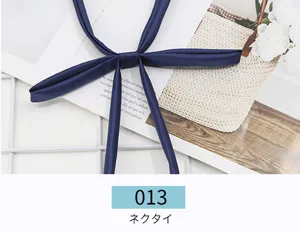 Dark blue JK uniform necktie ribbon, classic Japanese sailor suit collar accessory detail view.