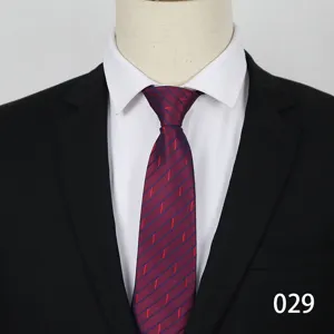 Close-up detail of a classic burgundy business tie featuring elegant diagonal striped patterns.