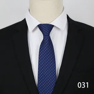 Blue patterned business necktie for men, formal wear matching white shirt and black suit.