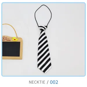 Detail view of the black and white striped kids necktie, showing the classic diagonal pattern.