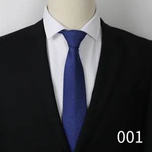 Detailed view of the elegant blue textured necktie showing fabric quality for formal business suit.