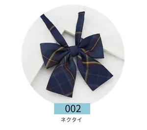 Detailed close-up view of dark blue plaid JK bow tie, featuring classic Japanese school style.
