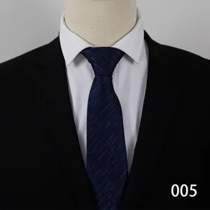 Business formal dark blue plaid necktie detail, matching white shirt and black suit.