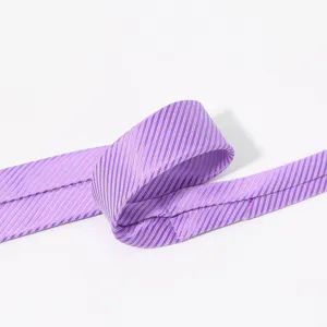 Close-up detail of the elegant purple striped necktie showing fine fabric texture.