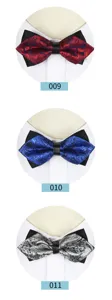 Detailed view of men's paisley bow tie variants, showcasing elegant patterned fabric and texture.