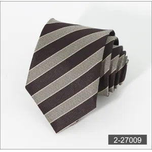 Close-up detail of brown and beige striped men's necktie rolled up neatly, business style texture.
