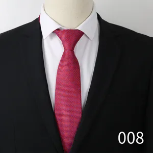 Detail shot of a sophisticated red and blue patterned business tie paired with formal attire.