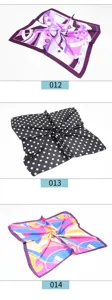 Detailed view of women's 60cm square silk scarf with assorted geometric prints and polka dots.