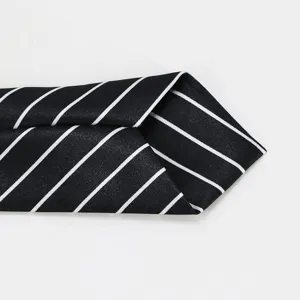Black and white striped student JK tie main view showing classic school uniform necktie design.