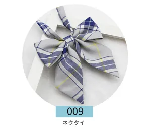Japanese JK uniform plaid bow tie detail shot, grey and blue fabric school ribbon accessory.