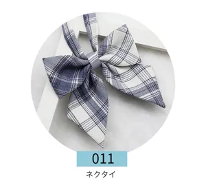 This detailed close-up shot of a Japanese JK uniform blue and white plaid bow tie.