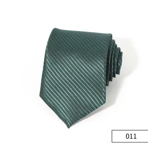 Detailed close-up view of the dark green striped business necktie highlighting fabric texture.