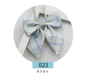 Close-up detail of the Japanese JK uniform plaid bow tie in blue and green colors.