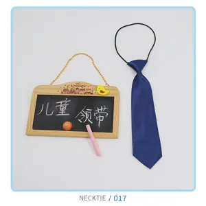 Detail view of the blue children's necktie with elastic band, neat fabric texture.