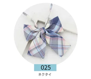 Japanese JK uniform plaid bow tie detail shot, blue pink checkered flat butterfly knot design.