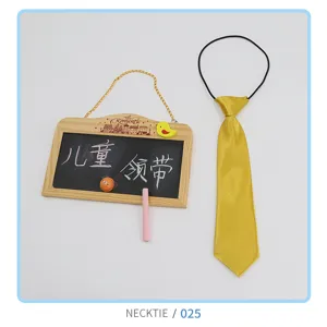 Close-up detail of children shiny gold necktie with elastic band for daily wear kids.
