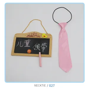 Children's pink necktie detail, cute elastic band design for kids, stylish apparel accessory.