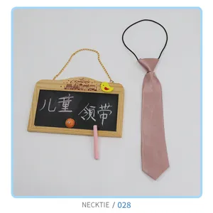 Children pink necktie detail, cute elastic strap design, soft fabric material showcase.