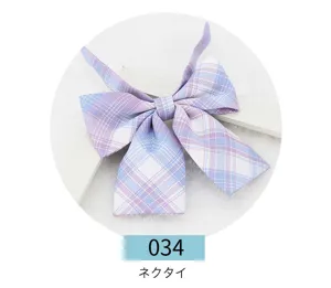 Detailed shot of the blue and purple plaid JK uniform ribbon bow, cute pleated fabric.